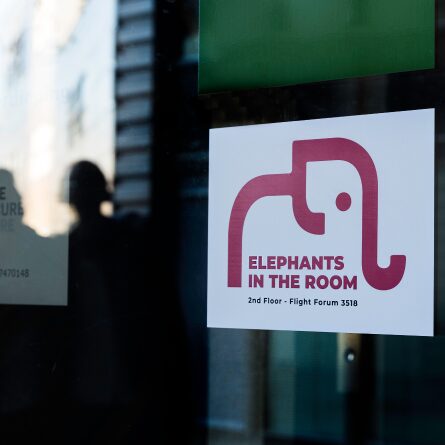 The Elephants in the Room sign on the door of our office